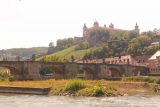 Wurzburg_145_07242018 - Along the banks of the Main River looking back towards the Festung Marienberg with the Alte Mainbrucke in the foreground