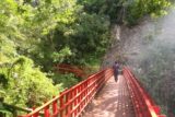 Xiaowulai_Waterfall_050_11012016 - Traversing the red footbridge damaged from a landslide as we headed to the base of the Xiaowulai Waterfall