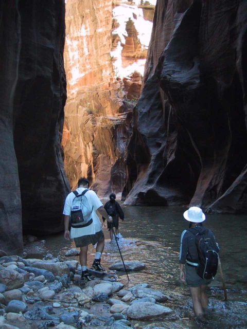 That's me in the white shirt attempting to hike in the Zion Narrows on an old pair of basketball sneakers, which wasn't the wisest idea, but I was a hiking newbie back in 2001