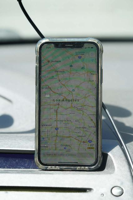 The Apple iPhone using Apple Maps to route