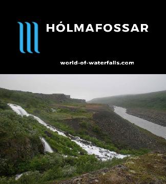 Holmafossar (Hólmafossar) is a fairly high-volume cascade tumbling on a tributary to the Jökulsá á Fjöllum River accessed by a lightly-used 2.6km return hike.