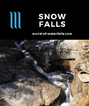 Snow Falls is a 25ft slanted roadside waterfall on the Little Androscoggin River spilling into a scenic lake fringed by Autumn colors near West Paris, Maine.